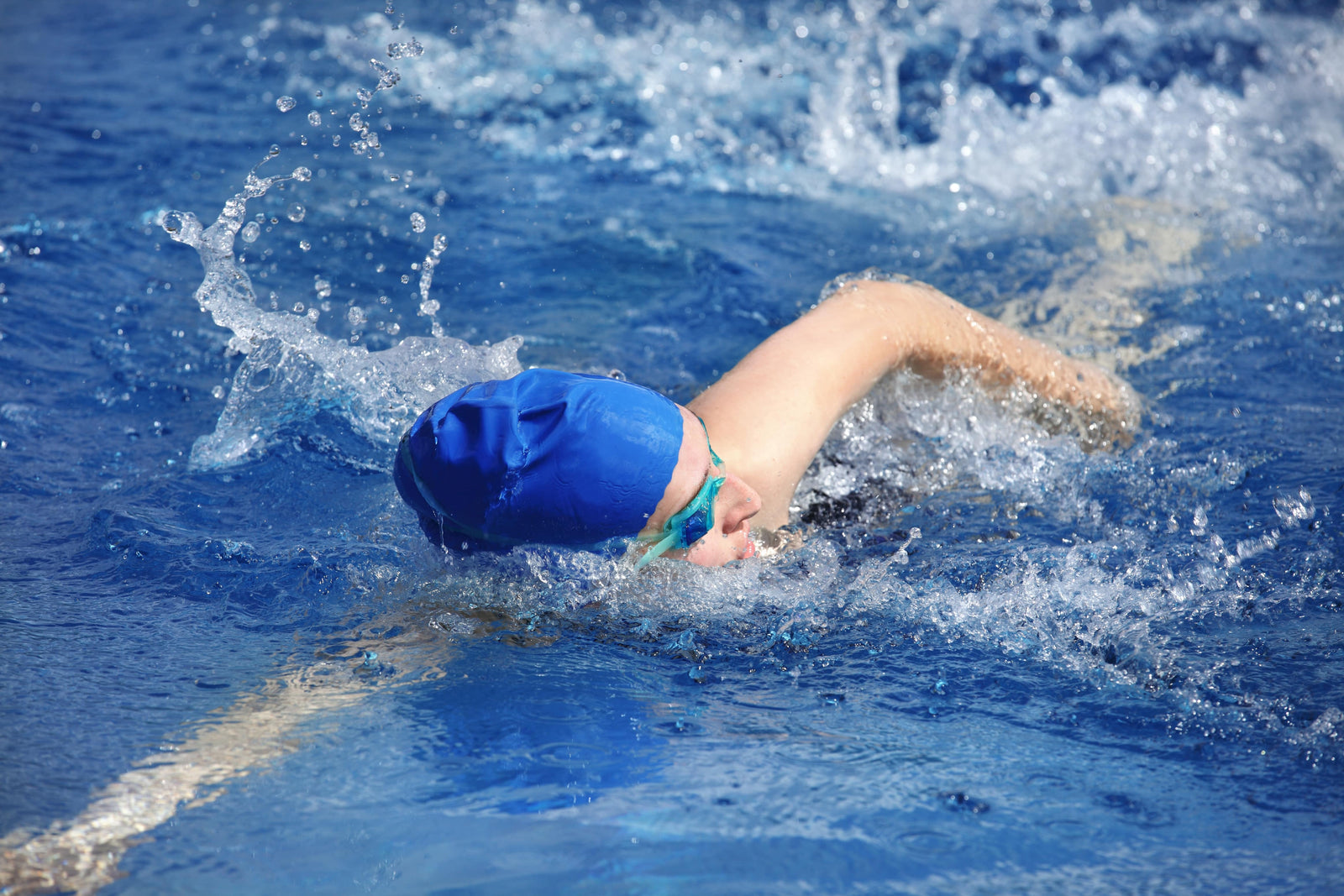 A triathlete, fueled by low-calorie protein sources, races in a triathlon