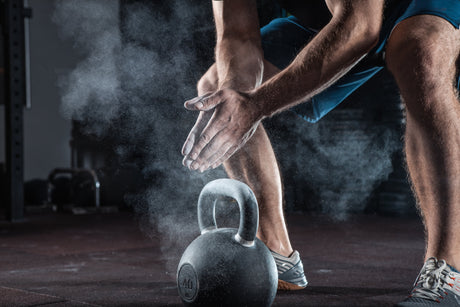 Young athlete who knows when to take protein before or after workout is getting ready for training
