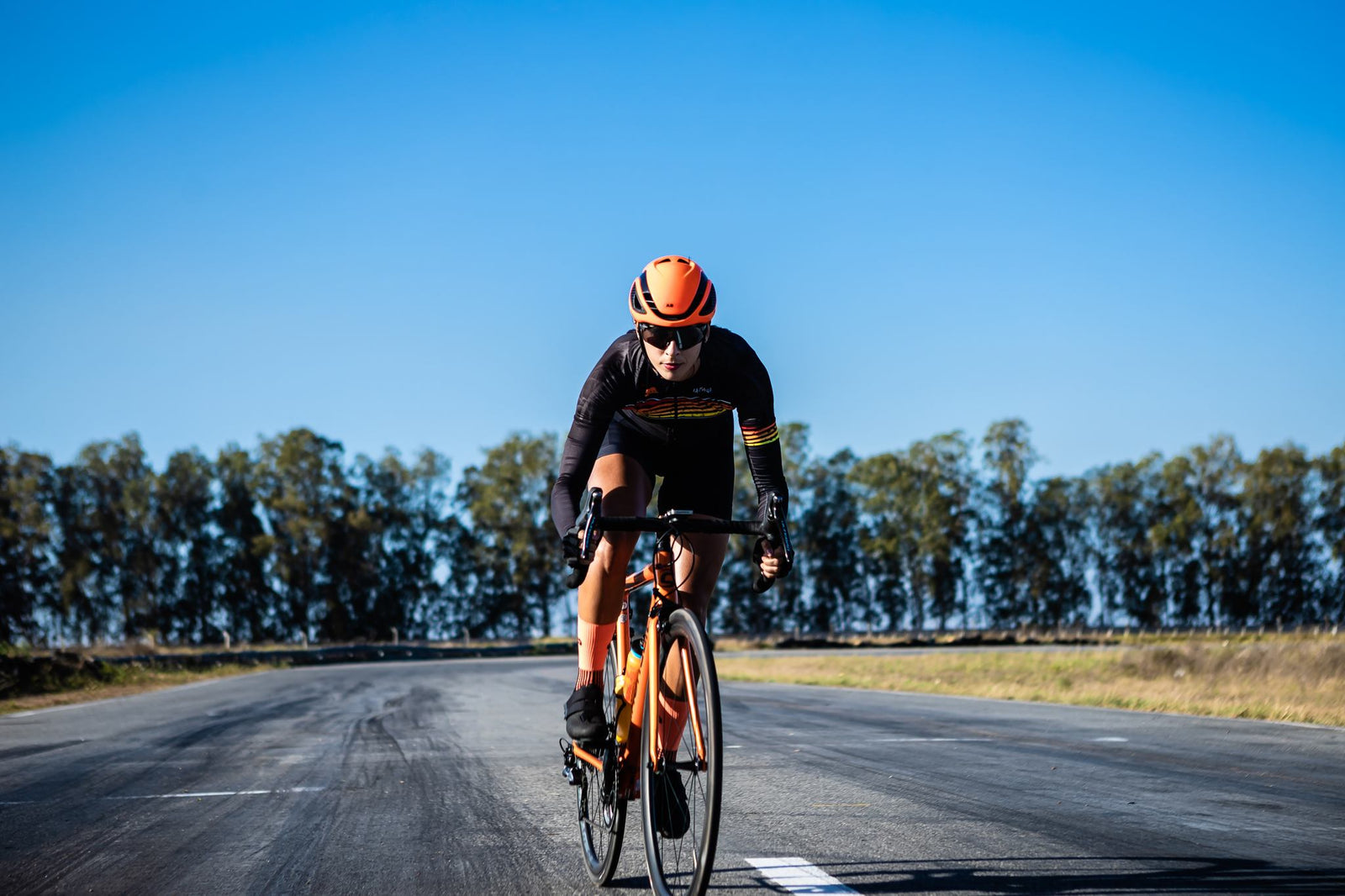 Cyclist aided by top-rated liquid protein supplements for endurance athletes is riding through a beautiful natural landscape
