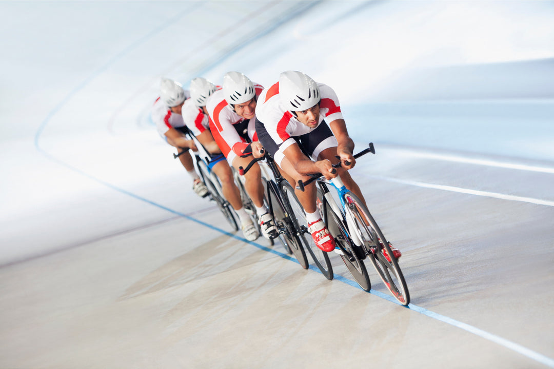 Competitive cyclists informed by their doctor about why athletes take collagen are on a racing cycle track