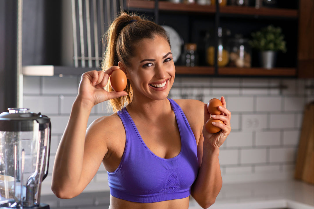 Fit woman holding eggs — one of the easy protein sources