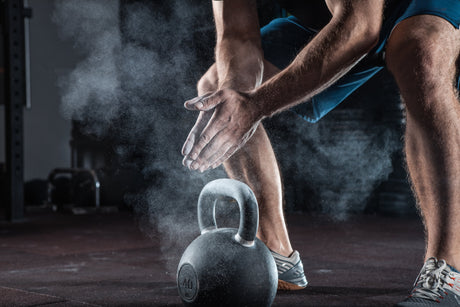 Young athlete who knows when to take protein before or after workout is getting ready for training