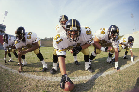 Football athletes practicing in a two a days football training session